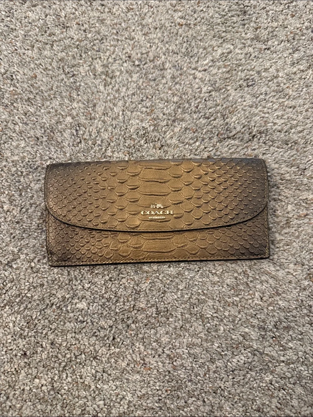 Coach Metallic snake-embossed leather envelope wallet in a muted gold tone